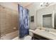 Clean bathroom with shower/tub combo and updated vanity at 9323 Bella Vita Cir, Land O Lakes, FL 34637