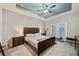 Main bedroom with king-size bed and private access at 9323 Bella Vita Cir, Land O Lakes, FL 34637