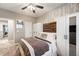Bright bedroom with a cozy bed, built-in wardrobe, and natural light at 9323 Bella Vita Cir, Land O Lakes, FL 34637