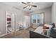 Bright bedroom with daybed, access to another bedroom, and built-in closet at 9323 Bella Vita Cir, Land O Lakes, FL 34637