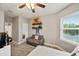 Charming bedroom with couch, large window, and plenty of natural light at 9323 Bella Vita Cir, Land O Lakes, FL 34637
