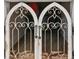 Elegant arched dog gate with a metal design at 9323 Bella Vita Cir, Land O Lakes, FL 34637