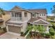 Two-story house featuring balcony, garage, and lush landscaping at 9323 Bella Vita Cir, Land O Lakes, FL 34637