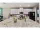 Gourmet kitchen with granite countertops and modern stainless steel appliances at 9323 Bella Vita Cir, Land O Lakes, FL 34637