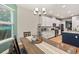 Open concept kitchen with an island, stainless steel appliances, and wood flooring at 9323 Bella Vita Cir, Land O Lakes, FL 34637