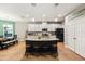 Open concept kitchen with island, stainless steel appliances, and hardwood floors at 9323 Bella Vita Cir, Land O Lakes, FL 34637