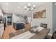 Open concept kitchen with an island, stainless steel appliances, and wood flooring at 9323 Bella Vita Cir, Land O Lakes, FL 34637