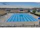 Community lap pool with lounge chairs at 9323 Bella Vita Cir, Land O Lakes, FL 34637