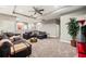 Cozy media room with sectional sofa and TV at 9323 Bella Vita Cir, Land O Lakes, FL 34637