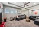 Entertainment area with sectional sofa and large TV at 9323 Bella Vita Cir, Land O Lakes, FL 34637