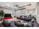 Comfortable media room with sectional sofa and large TV at 9323 Bella Vita Cir, Land O Lakes, FL 34637
