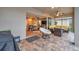 Covered patio with wicker furniture and a view of the living room at 9323 Bella Vita Cir, Land O Lakes, FL 34637