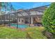 Enjoy this refreshing pool and spa, screened and beautifully landscaped at 9323 Bella Vita Cir, Land O Lakes, FL 34637