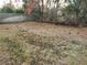 Large backyard with grassy area and wooden fence at 10185 Horizon Dr, Spring Hill, FL 34608