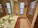 Bathroom with tub shower and tiled floors at 10185 Horizon Dr, Spring Hill, FL 34608