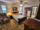 Main bedroom with double bed and ensuite bathroom at 10185 Horizon Dr, Spring Hill, FL 34608