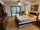 Main bedroom with access to a screened porch at 10185 Horizon Dr, Spring Hill, FL 34608
