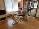 Dining area with table and chairs, and access to a screened porch at 10185 Horizon Dr, Spring Hill, FL 34608