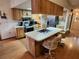 Eat-in kitchen with an island and wood cabinets at 10185 Horizon Dr, Spring Hill, FL 34608