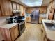 Spacious kitchen with stainless steel appliances and wood cabinets at 10185 Horizon Dr, Spring Hill, FL 34608