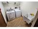 Laundry room with washer, dryer, and utility sink at 10185 Horizon Dr, Spring Hill, FL 34608