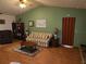 Living room with striped sofa and wood flooring at 10185 Horizon Dr, Spring Hill, FL 34608