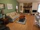 Living room with striped sofa and stone fireplace at 10185 Horizon Dr, Spring Hill, FL 34608