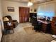 Home office with a desk and recliner chair at 10185 Horizon Dr, Spring Hill, FL 34608