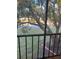 Peaceful balcony view of lush greenery and water at 108 Lakeside Dr, Oldsmar, FL 34677