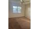 Spacious bedroom with ceiling fan and large closet at 108 Lakeside Dr, Oldsmar, FL 34677