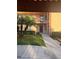 Condo building entrance with walkway and landscaping at 108 Lakeside Dr, Oldsmar, FL 34677