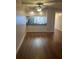 Bright dining area with wood-look floors and kitchen views at 108 Lakeside Dr, Oldsmar, FL 34677
