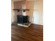 Cozy corner fireplace with stone hearth and metal screen at 108 Lakeside Dr, Oldsmar, FL 34677