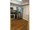 Modern kitchen with stainless steel appliances and wood flooring at 108 Lakeside Dr, Oldsmar, FL 34677