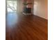 Living room with fireplace and sliding glass doors to balcony at 108 Lakeside Dr, Oldsmar, FL 34677