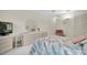 Bedroom with double bed, dresser, and a TV at 11030 Linkside Dr # 11030, Port Richey, FL 34668