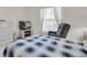 Bedroom with a bed, recliner, and TV at 11030 Linkside Dr # 11030, Port Richey, FL 34668