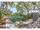Bocce ball court with benches under the trees at 11030 Linkside Dr # 11030, Port Richey, FL 34668