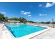 Large community pool with surrounding deck at 11030 Linkside Dr # 11030, Port Richey, FL 34668