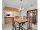 Bright dining room features wood table and chairs, and a hutch at 11030 Linkside Dr # 11030, Port Richey, FL 34668