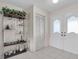 Bright entryway with white doors and tiled floor at 11030 Linkside Dr # 11030, Port Richey, FL 34668