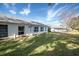 View of multiple houses with well-maintained lawns at 11030 Linkside Dr # 11030, Port Richey, FL 34668