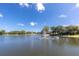Serene lake view with a central water fountain at 11030 Linkside Dr # 11030, Port Richey, FL 34668