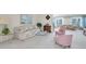 Open living area with multiple seating areas, great for entertaining at 11030 Linkside Dr # 11030, Port Richey, FL 34668