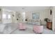 Living room with pink armchairs and a floral sofa at 11030 Linkside Dr # 11030, Port Richey, FL 34668