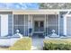 Enclosed porch with seating area, perfect for relaxing outdoors at 11030 Linkside Dr # 11030, Port Richey, FL 34668