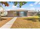 House exterior with sliding glass doors at 13637 Lagoon Dr, Hudson, FL 34667