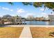 Canal-front property with a walkway and dock at 13637 Lagoon Dr, Hudson, FL 34667