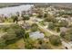Aerial view showcasing home's location near lake at 13721 Mill Pl, Odessa, FL 33556