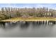 Aerial view of lakeside community with picnic tables and dock at 13721 Mill Pl, Odessa, FL 33556